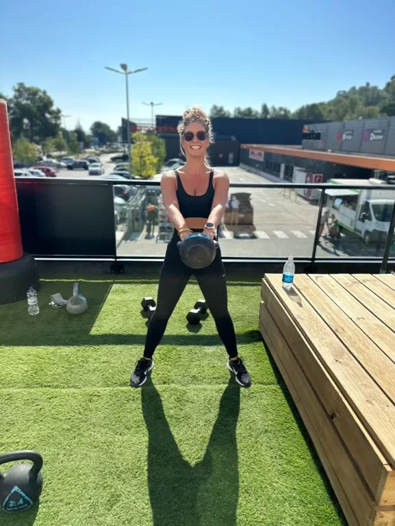 CiCi training outdoors with a kettlebell